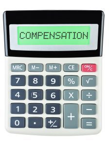 A calculator with the words 'compensation' written on the little screen. 