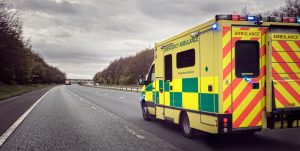 An ambulance is travelling down a motorway. 