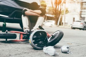 An accident involving an e-scooter and car. 