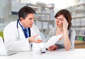 A doctor diagnosing fibromyalgia with a patient.