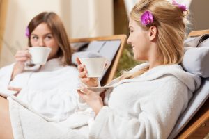 Two women relax at a health spa.