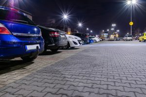 A row of cars are parked in a car park. 