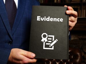 Black evidence book with white writing