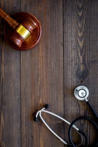 The stethoscope and gavel symbolise No Win No Fee prescription error compensation claims.