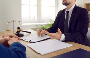 A solicitor explaining farm accident claims to the client.