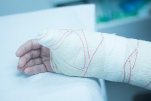 PERSON WITH INJURED BANDAGED ARM AFTER DOG ATTACK