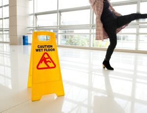 OFFICE WORKER SLIPPING ON A WET FLOOR