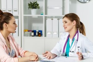 Doctor talking to female patient.