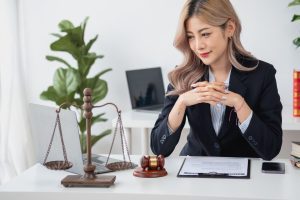 Female solicitor sat at desk.