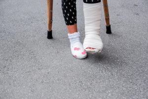 School girl with broken leg due to a teacher failing to use a wet floor sign